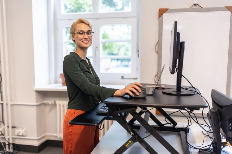 Portrait of a businesswoman working at her standing desk at startup office